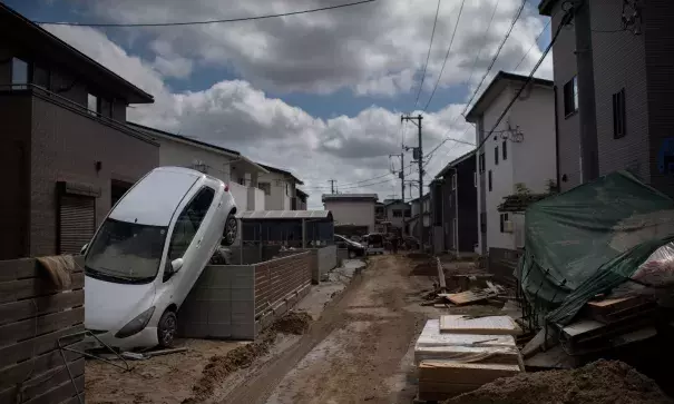 A street devastated by floods and landslides in Mabi, Okayama prefecture. Credit: Martin Bureau, AFP