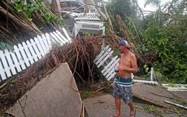 Robert Phillips looks at the former Key West house of poet and author Shel Silverstein, which was crushed by a falling tree as Hurricane Irma swept through, September 10, 2017. Photo: Charles Trainor, Jr.