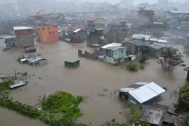 Houses, partially submerged in floods waters caused by heavy rains brought by Typhoon Koppu, are seen in City Camp Lagoon at Baguio city, north of Manila October 19, 2015. Typhoon Koppu swept across the northern Philippines killing at least nine people as trees, power lines and walls were toppled and flood waters spread far from riverbeds, but tens of thousands of people were evacuated in time. (REUTERS/Harley Palangchao)