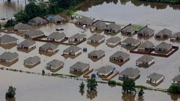 In this aerial photo over Hammond, La., flooded homes are seen off of LA-1064 after heavy rains inundated the region, Saturday, Aug. 13, 2016. Photo: Max Becherer, AP