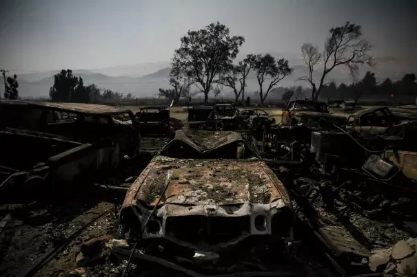 Burned vehicles glow in the light of the full moon on Highway 138 in Phelan as the Blue Cut fire burned in San Bernardino County. Photo: Marcus Yam / Los Angeles Times