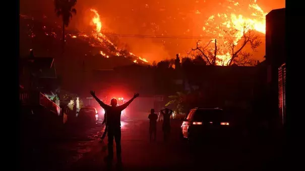 Residents watch the Thomas fire burn in the hills above La Conchita in Ventura County. Photo: Wally Skalij, Los Angeles Times