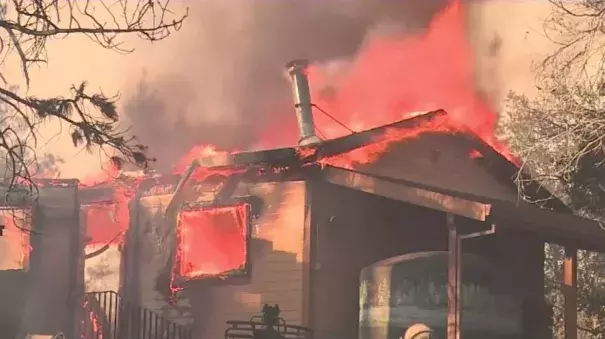 Over 1,100 firefighters are currently battling the Ponderosa Fire in Butte County that has destroyed ten homes. A suspect was arrested in connection with the fire Tuesday. 