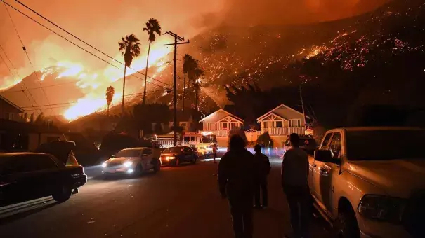Residents watch the Thomas fire burn from Prospect Street in Ventura. Climate change makes fires more likely, for a variety of reasons. Photo: Michael Owen Baker, LA Times