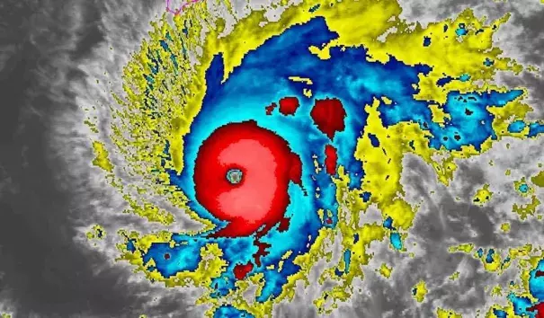 Enhanced infrared image of Hurricane Lane at 0400Z Wednesday, August 21, 2018 (midnight Tuesday night EDT). The southernmost part of the Big Island is outlined in pink at top center. Credit: NOAA/NESDIS