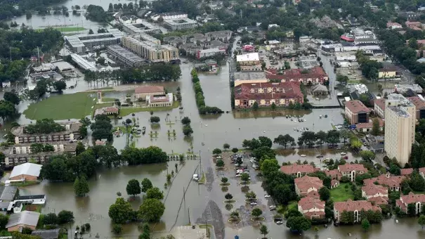 This aerial image shows flooded areas on and near the campus of Louisiana State University (LSU), Saturday, Aug. 13, 2016, in Baton Rouge, La. Photo: Patrick Dennis / The Advocate via AP