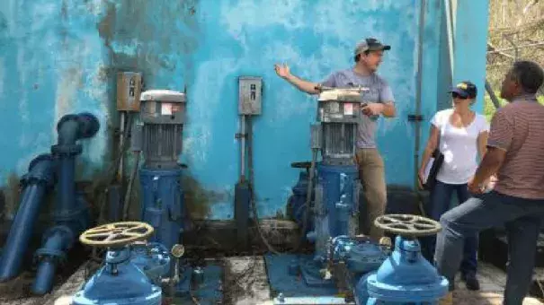 The Environmental Protection Agency and partners examine the drinking water system that isn't run by the government's water and sewer services in Cañabón, Puerto Rico, following the storm. Photo: EPA