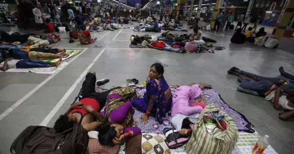 Stranded passengers in a railway station in Kolkata, India, in May after trains were canceled because of Cyclone Fani. Photo: Rupak De Chowdhuri, Reuters