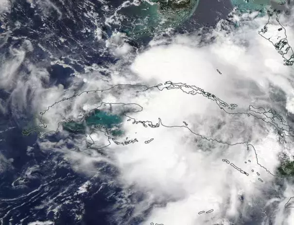 MODIS visible satellite image of Tropical Depression Nine (formerly 99L) forming in the Florida Straits on Sunday afternoon, August 28, 2016. Image: NASA