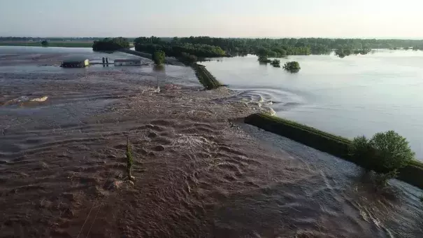 A breached levee on the Arkansas River, a common sight this spring. Photo: AP
