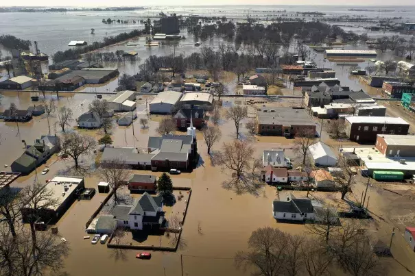 Homes and businesses are surrounded by floodwater in Hamburg, Iowa. Several Midwest states are battling some of the worst flooding they have experienced in decades as rain and snow melt from the recent “bomb cyclone” has inundated rivers and streams. Photo: Scott Olson, Getty Images