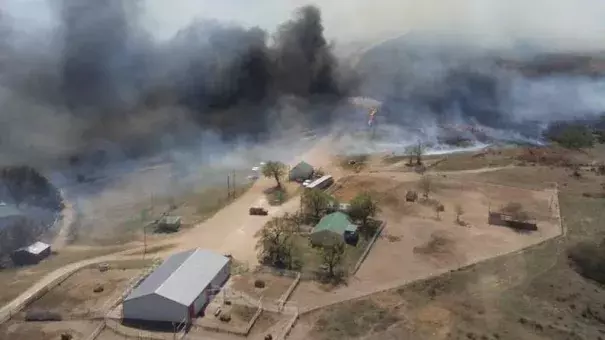 The Anderson Creek Fire threatening ranch buildings in Woods County, Okla., on Thursday. The fire has burned nearly 400,000 acres in two states. Photo: Oklahoma Forestry Services