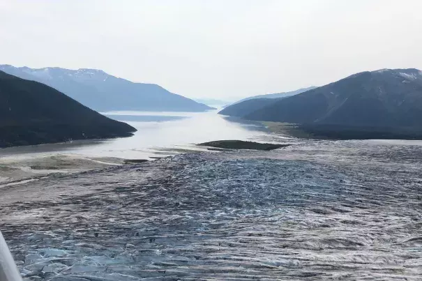 The terminus of Taku Glacier and the Taku River are seen from an aircraft, looking southwest, on Aug. 2. Credit: James Brooks/ADN