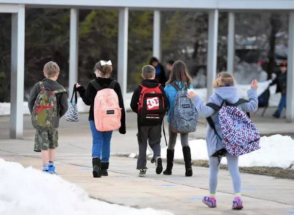 Students made their way into Forest Lakes Elementary School Monday morning to begin their day after a week long break because of last week's blizzard. Photo: Matt Button, Aegis Staff, Baltimore Sun