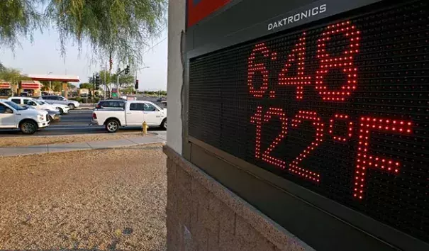 Motorists stop at an intersection where a sign displays the temperature on June 20, 2017 in Phoenix, Arizona. The Phoenix airport hit 119° that day, their fourth hottest temperature on record, and just 3° below their all-time hottest temperature ever recorded. Photo: Ralph Freso, Getty Images