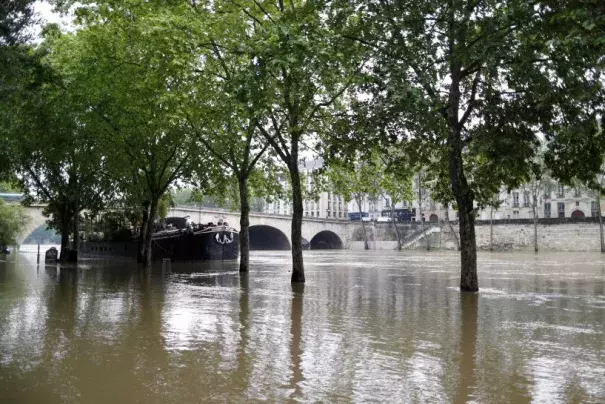 General view of the flooded river-side of the River Seine in central Paris with the 'Ile Saint-Louis' in the background. Photo: Charles Platiau
