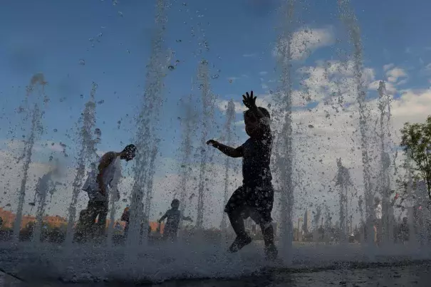 Children play in a water feature in Domino Park as a heatwave continued to affect the region in Brooklyn, New York City, New York, U.S., July 21, 2019. Credit: Andrew Kelly, Reuters