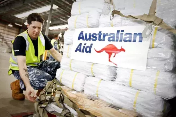Officer in Charge of Air Movements at RAAF Amberley, Flying Officer Don Ninness, prepares Australian Aid before it is loaded onto a No. 36 Squadron C-17A aircraft destined for Cyclone Winston-affected Fiji at RAAF Base Amberley near Brisbane, February 23, 2016. Photo: Australian Defence Force, Reuters