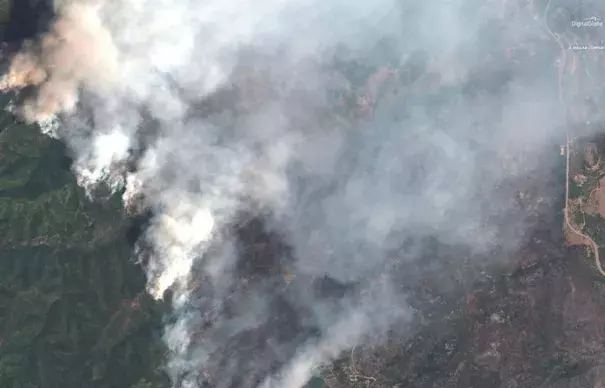 A satellite image shows the 416 Wildfire burning west of Highway 550 and northwest of Hermosa, Colorado, U.S., June 10, 2018. Credit: Maxar company, via REUTERS