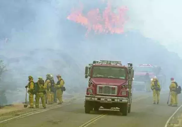 Firefighters perform a firing operation along Interlake Road while battling the Chimney Fire in southern Monterey County on Tuesday. The fire started south of Nacimiento Reservoir in San Luis Obispo County. Photo: David Royal, Monterey Herald