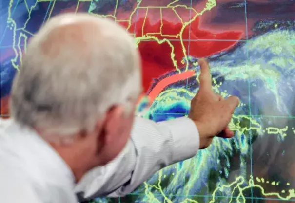  In this Oct. 19, 2005 file photo, Max Mayfield, the former director of the hurricane center (now retired), draws a line showing one of the possible trajectories of Hurricane Wilma in Miami. It’s not just this year. The monster hurricanes Harvey, Irma, Maria, Jose and now Lee that have raged across the Atlantic are contributing to what appears to be the most active period for major storms on record. Photo: Alan Diaz, AP