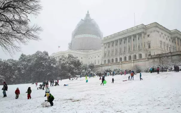 Children sled on the west lawn of the U.S. Capitol during a snow storm in Washington. Photo: Reuters
