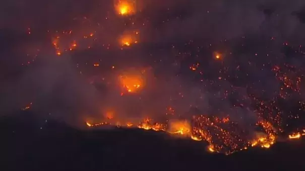 A fast-moving Northern California wildfire driven by fierce winds threatened the Sonoma County town of Geyserville on Oct. 24, prompting mandatory evacuations. Credit: Reuters