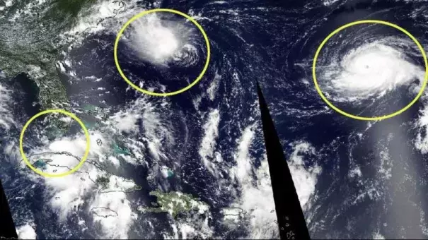 Circled on the satellite image are the three active Atlantic tropical cyclones on Sunday. Tropical Depression Nine (left), Tropical Depression Eight (center) and Hurricane Gaston (right). Image: The Weather Channel, NASA