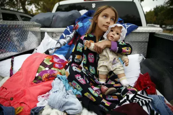 Zayann Nelson, whose family's house in Cpbb was totally destroyed by the Valley Fire, sits in the back of her family's pick up truck at the Napa County Fairgrounds in Calistoga, Calif., on Monday, September 14, 2015. Photo: Scott Strazzante, The Chronicle