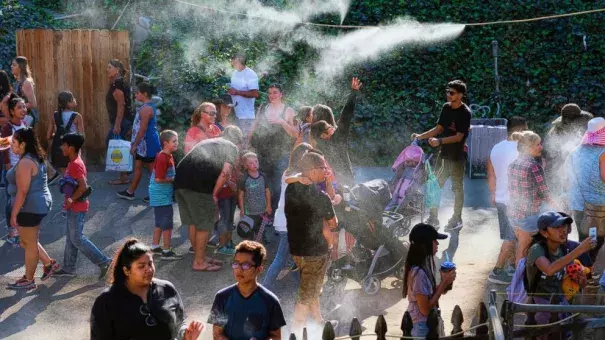 In this Saturday, Sept. 24, 2016 photo, visitors to the Los Angeles County fair cool off under outdoor misters in Pomona, Calif. Californians braced Monday, Sept. 26 for another hot autumn day as forecasters warned of soaring temperatures and potential wildfires due to hot, dry and windy conditions. Photo: Richard Vogel, AP