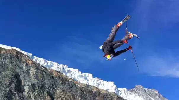 This photo taken from a 4K video and dated Wednesday, Oct. 18, 2017 shows a skier performing a jump during training on the glacier above Saas-Fee, Switzerland. The glacier attracted skiers and snowboard athletes from an array of nations, who came hunting for snow on which to train early in the season ahead of the 2018 Pyeongchang Olympics. Photo: John Leicester, AP