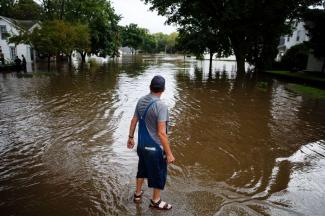 Tom Moffit survey's the flood waters filling his house and street on Friday, Sept. 23, 2016, in Shell Rock, Iowa. Photo: Brian Powers, AP