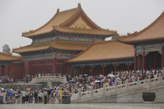 Tourists visit the Forbidden City in Beijing in early July. Photo: Wu Hong/European Pressphoto Agency
