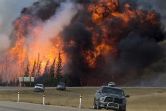 A wildfire burns near Fort McMurray, Alberta, Canada, on May 7. Photo: Premier of Alberta/flickr