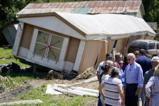 President Joe Biden tours a neighborhood impacted by flooding, Monday, Aug. 8, 2022, in Lost Creek, Ky. (Credit: AP Photo/Evan Vucci)
