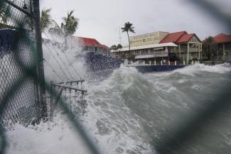 Waves crash against a seawall as Hurricane Ian passes through George Town, Grand Cayman island, Monday, Sept. 26, 2022. (AP Photo/Kevin Morales)