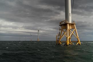 The five turbines of America's first offshore wind farm, owned by the Danish company, Orsted, stand off the coast of Block Island, R.I., Monday, Oct. 17, 2022. Hundreds of offshore wind developers and experts gathered in Rhode Island to talk about the future of clean energy— how to grow the offshore wind industry and address shared challenges. (Credit: AP Photo/David Goldman)