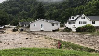 Damage from flooding is seen Wednesday in the Whitewood community of Buchanan County. (Credit: Olivia Bailey/AP)