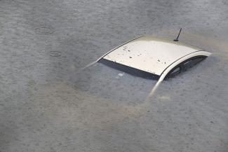A submerged car on Interstate 610 North in Houston, as the city coped with flooding from the rain of Hurricane Harvey. Credit: Thomas Shea, Getty Images
