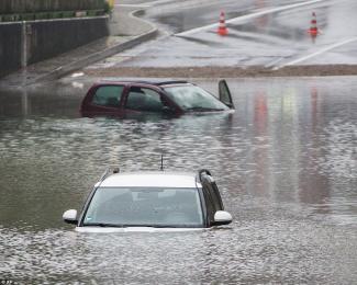 Cars are submerged in an underpass in Oberhausen after torrential rains caused flash floods across southern Germany. Photo: AP