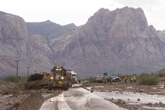 Crews on Highway 159 just south of Bonnie Springs in Red Rock Canyon National Conservation Area near Las Vegas work to reopen the highway, which was closed because of a washout Thursday. Photo: Jason Ogulnik//Las Vegas Review-Journal / AP