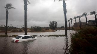 A car is partially submerged in floodwaters from Tropical Storm Hilary in Cathedral City, Calif. on Aug. 20. (Credit: Mario Tama/Getty Images)