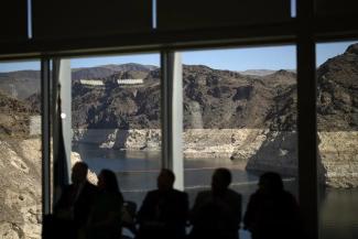 Officials listen during a news conference on Lake Mead at the Hoover Dam Tuesday, April 11, 2023, near Boulder City, Nev. The Biden administration on Tuesday released an environmental analysis of competing plans for how Western states and tribes reliant on the dwindling Colorado River should cut their use. (Credit: AP Photo/John Locher)