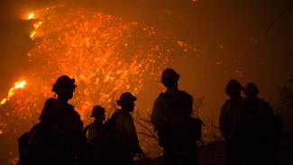 Firefighters battle an expanding wildfire Friday night near Santa Barbara, California. Photo: AFP / Getty