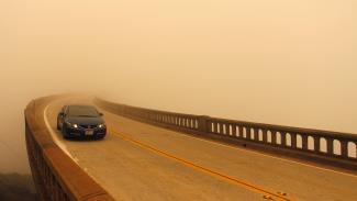 Smoke from the Soberanes Fire reduces visibility over the typically scenic Bixby Bridge on Highway 1 north of Big Sur on Tuesday. Photo: Reuters
