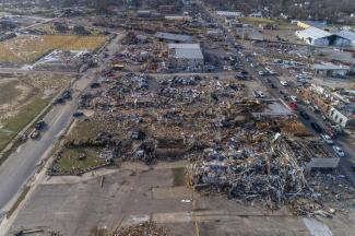 In this photo taken by a drone, buildings are demolished in downtown Mayfield, Ky., on Saturday, Dec. 11, 2021, after a tornado traveled through the region Friday night. A monstrous tornado killed dozens of people in Kentucky and the toll was climbing Saturday after severe weather ripped through at least five states, leaving widespread devastation. (Ryan C. Hermens/Lexington Herald-Leader via AP)