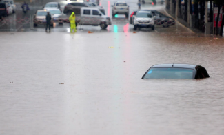 Flooding on the roads in Jiujiang, China. Photo: Feature China / Barcroft Images