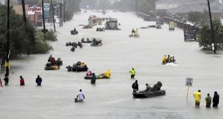 Rescue boats fill a Houston street from flooded from Superstorm Harvey, August 28. Photo: David J. Phillip AP