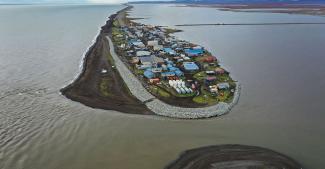 An aerial view from a drone shows the village of Kivalina, Alaska, which sits at the very end of an eight-mile barrier reef located between a lagoon and the Chukchi Sea, photographed on September 10, 2019. Photo: Joe Raedle, Getty