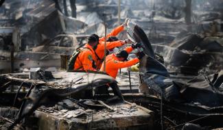 Search and Rescue personnel look for human remains in the Journey's End Mobile Home park following the damage caused by the Tubbs Fire on Oct. 13, 2017 in Santa Rosa, California. Photo: Elijah Nouvelage, Getty Images